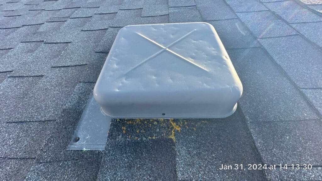  Hail damage on metal roof vent cover
