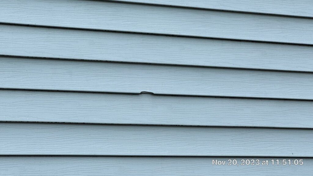 Hole in siding from hail