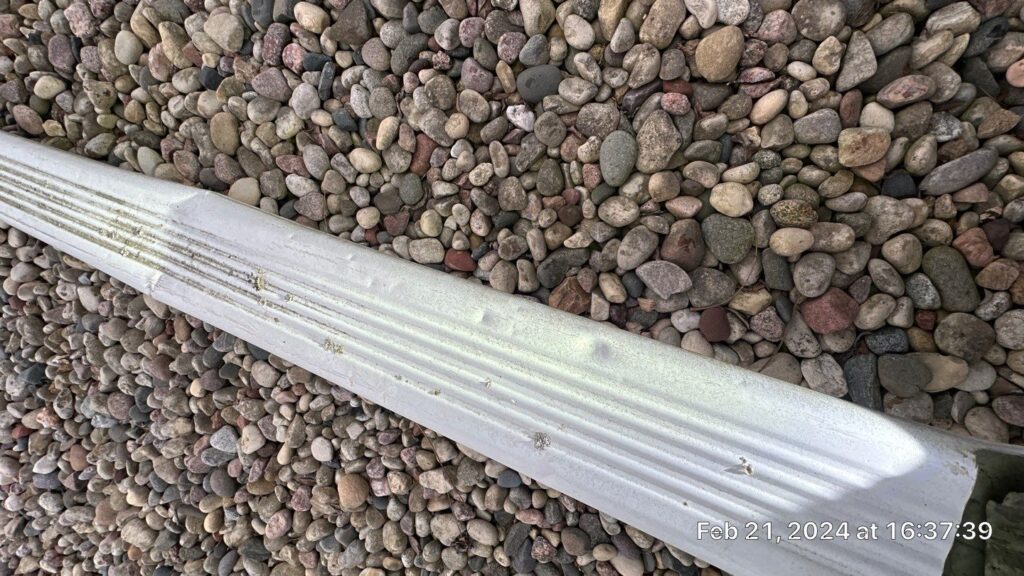 Hail damage on downspouts
